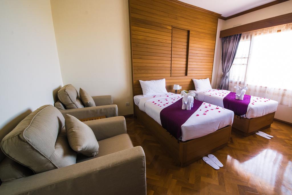 Win Unity Hotel Мемьо Экстерьер фото