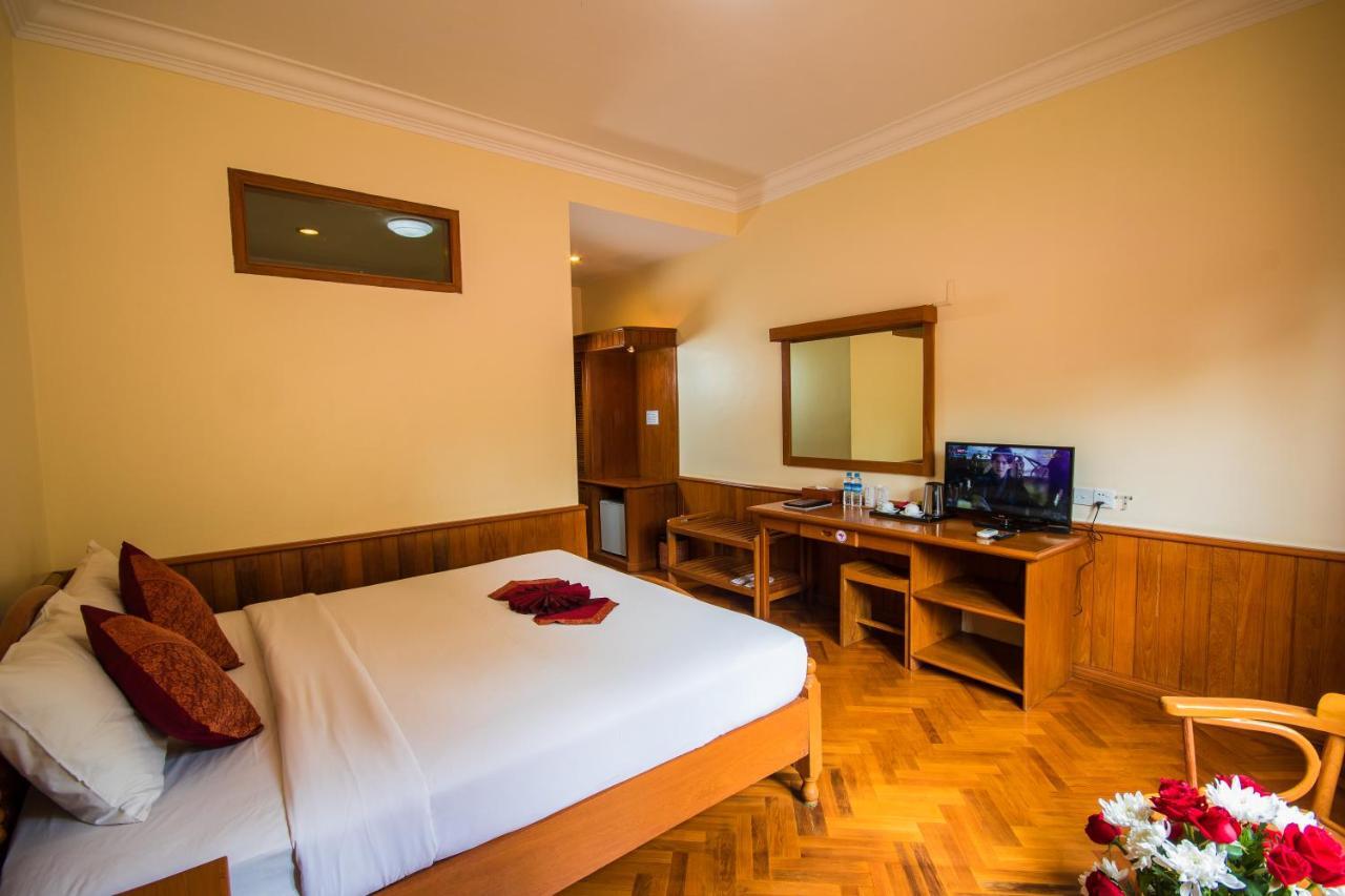 Win Unity Hotel Мемьо Экстерьер фото